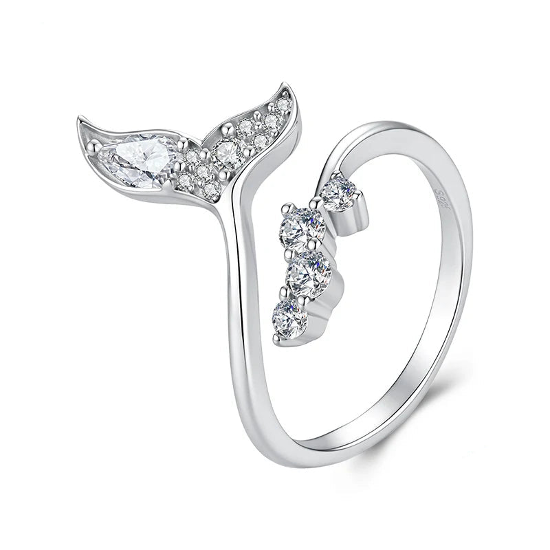 A sterling silver mermaid tail ring with clear gemstones, shown on a white background.
