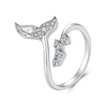 A sterling silver mermaid tail ring with clear gemstones, shown on a white background.