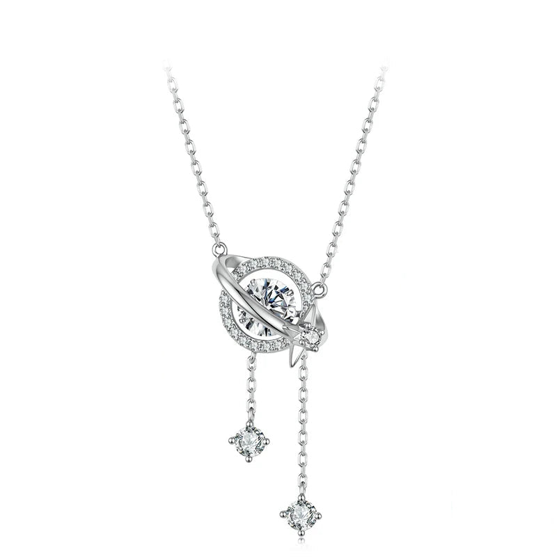A sterling silver necklace with a celestial pendant featuring a central clear gemstone, surrounded by a ring of small clear stones, with two dangling star-shaped charms.