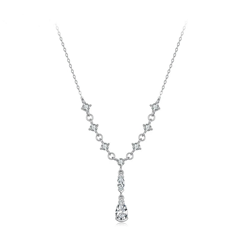 A sterling silver Y-necklace with clear cubic zirconia stones, featuring a delicate chain, star-shaped links, and a teardrop pendant.