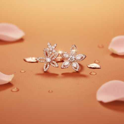 A pair of silver flower-shaped stud earrings paved with clear cubic zirconia stones, displayed on a warm peach surface with a blurred orange background.
