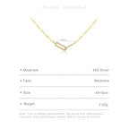 Gold necklace with measurement details on a white background