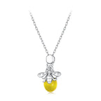 A sterling silver bee pendant necklace with a yellow bead and clear rhinestones, shown on a white background.