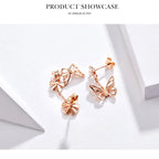 Rose gold butterfly earrings on a white background with 'Product Showcase' text.