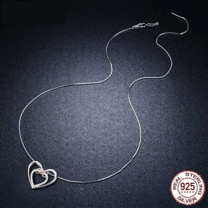 Entwined Hearts: Sterling Silver Infinity Necklace with Double Hearts - Necklaces