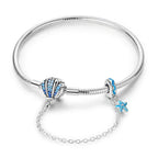 Coastal Sterling Silver Charm Bracelet With Sparkling Seashell Bracelets